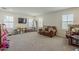 Spacious and bright living room with multiple windows and ample space for Gathering activities at 4607 S Venus --, Mesa, AZ 85212