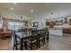 An open-concept home featuring the dining room, kitchen, and living room, with wood-look tile flooring at 4607 S Venus --, Mesa, AZ 85212