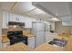 Kitchen featuring white cabinets and laminate countertops at 540 N May -- # 2148, Mesa, AZ 85201