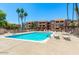 Inviting community pool offers residents a refreshing oasis with ample lounge seating and sunny skies at 540 N May -- # 2148, Mesa, AZ 85201