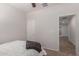 A bedroom with adjacent door access to another room in the house at 7008 W Southgate Ave, Phoenix, AZ 85043