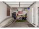 Organized garage features ample storage with shelving, a workbench, and kayak storage at 7008 W Southgate Ave, Phoenix, AZ 85043