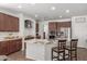 Gourmet kitchen features granite countertops and stainless steel appliances at 7008 W Southgate Ave, Phoenix, AZ 85043