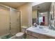 Standard bathroom featuring neutral finishes, a toilet, and a shower with sliding glass door at 7101 W Beardsley Rd # 422, Glendale, AZ 85308