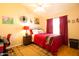 Cozy bedroom with Southwestern decor, bright natural light and modern ceiling fan at 7101 W Beardsley Rd # 422, Glendale, AZ 85308