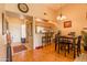 Open concept dining area and kitchen with wood floors and a breakfast bar at 7101 W Beardsley Rd # 422, Glendale, AZ 85308