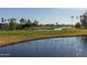 Scenic aerial view of a golf course with water features and lush green landscape at 7101 W Beardsley Rd # 422, Glendale, AZ 85308