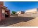 Spacious backyard with rock landscaping, block fencing, and covered patio at 7227 S 13Th Way, Phoenix, AZ 85042
