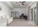 Spacious living room featuring carpet floors, comfortable seating, and a sliding glass door at 7227 S 13Th Way, Phoenix, AZ 85042