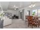 Open-concept living space featuring carpet floors, a dining area, and office space at 7227 S 13Th Way, Phoenix, AZ 85042