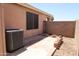 The backyard features a concrete patio, brick border, and desert landscaping at 7425 N 69Th Ln, Glendale, AZ 85303