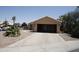 Single-story house featuring a front-facing garage and a well-maintained lawn at 7425 N 69Th Ln, Glendale, AZ 85303