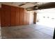 Spacious garage with ample cabinet storage along the walls and an open garage door at 7425 N 69Th Ln, Glendale, AZ 85303