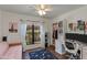 Bright bedroom with a modern ceiling fan, desk, and view to the outside at 7557 N Dreamy Draw Dr # 139, Phoenix, AZ 85020