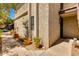 Exterior view of a condo building with desert landscaping, pots, and an address number at 7557 N Dreamy Draw Dr # 139, Phoenix, AZ 85020