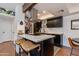 Modern kitchen featuring stainless steel appliances, a stylish island, and elegant white countertops at 7557 N Dreamy Draw Dr # 139, Phoenix, AZ 85020