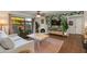 Comfortable living room boasts hardwood floors, stylish fireplace, and abundant natural light at 7557 N Dreamy Draw Dr # 139, Phoenix, AZ 85020