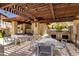 Outdoor grill area with shade structure, tables, and seating perfect for community gatherings at 7557 N Dreamy Draw Dr # 139, Phoenix, AZ 85020