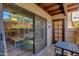 Cozy patio with sliding glass doors, table, and chairs offers a relaxing outdoor space at 7557 N Dreamy Draw Dr # 139, Phoenix, AZ 85020