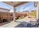 View of the backyard and patio, featuring a covered seating area at 9124 W Williams St, Tolleson, AZ 85353