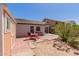 Charming backyard featuring a shed, patio, and green shrubs, perfect for outdoor enjoyment at 9124 W Williams St, Tolleson, AZ 85353