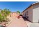 Spacious backyard features a shed, tiled patio with seating, and vibrant landscaping for outdoor enjoyment at 9124 W Williams St, Tolleson, AZ 85353