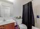 Bathroom featuring a vanity, toilet and a shower tub combination with neutral colored walls at 9124 W Williams St, Tolleson, AZ 85353