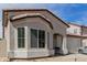Close-up of the charming home displaying the architecture and big front window at 9124 W Williams St, Tolleson, AZ 85353