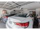 Spacious garage with two cars, a Nissan Sentra and Altima, offering ample storage and parking at 9124 W Williams St, Tolleson, AZ 85353