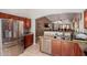 Functional kitchen with stainless steel appliances, granite countertops, and ample cabinet space at 9124 W Williams St, Tolleson, AZ 85353