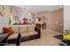 Spacious living room featuring tile floors and a comfortable sofa at 9124 W Williams St, Tolleson, AZ 85353
