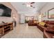 Open-concept living room with tile floors, recessed lighting, and comfortable seating at 9124 W Williams St, Tolleson, AZ 85353