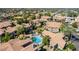 Aerial view showcasing community with a pool, lush landscaping, and well-maintained residential buildings at 9600 N 96Th St # 171, Scottsdale, AZ 85258