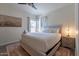 Bedroom with large windows, plush rug, neutral colors and a side table lamp at 9600 N 96Th St # 171, Scottsdale, AZ 85258