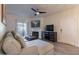 Relaxing living room with comfortable seating, a ceiling fan, fireplace, and access to the patio at 9600 N 96Th St # 171, Scottsdale, AZ 85258