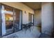 Cozy outdoor patio space with seating, accessible through sliding glass doors, offering a relaxing extension of the living area at 9600 N 96Th St # 171, Scottsdale, AZ 85258