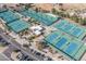 Aerial image highlighting community tennis courts with blue surfaces and a central building at 10429 N 101St St, Scottsdale, AZ 85258