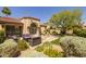 An inviting backyard with a patio and seating area under the shade of a tree at 10429 N 101St St, Scottsdale, AZ 85258