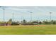 Baseball field showing the backstop, green outfield and batter's box at 10429 N 101St St, Scottsdale, AZ 85258