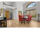 Bright dining room showcases large windows, modern lighting fixtures, and seating for six at 10429 N 101St St, Scottsdale, AZ 85258