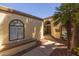 Inviting walkway that leads to the front door, accented by lush landscaping at 10429 N 101St St, Scottsdale, AZ 85258