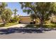 Charming single-story home featuring a well-manicured lawn and a two-car garage at 10429 N 101St St, Scottsdale, AZ 85258