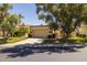 Charming single-level home with a two-car garage and well-manicured lawn at 10429 N 101St St, Scottsdale, AZ 85258