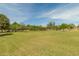Expansive community park with mature trees and ample green space for activities at 10429 N 101St St, Scottsdale, AZ 85258