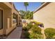 Outdoor kitchen with built-in grill and lush landscaping at 10429 N 101St St, Scottsdale, AZ 85258