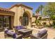 Cozy patio area with comfortable seating and a fire pit at 10429 N 101St St, Scottsdale, AZ 85258