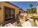 Outdoor cooking area with a built-in grill and adjacent hot tub at 10429 N 101St St, Scottsdale, AZ 85258