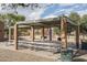 A shaded picnic area equipped with multiple picnic tables at 10429 N 101St St, Scottsdale, AZ 85258