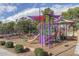 Colorful playground featuring slides, climbing structures, and shaded canopies at 10429 N 101St St, Scottsdale, AZ 85258