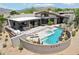 Aerial view of pool area with lush landscaping and mountain views at 10651 E Fernwood Ln, Scottsdale, AZ 85262